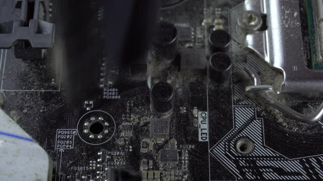 Dust pollution. Cleaning the motherboard from dust. Antistatic brush. 4k.