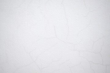 Obraz premium White cracked cement wall surface