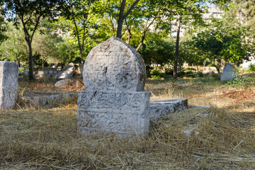 Tombstones over graves in the abandoned Arab cemetery in the quarter of Mamila in Jerusalem, Israel