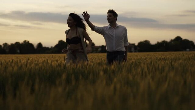Slow motion shot of couple dancing outdoors in the evening