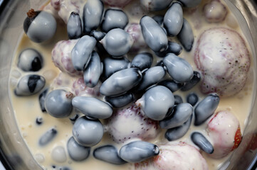 background of currant, raspberry, honeysuckle, Victoria and sliced banana drenched in fresh cream