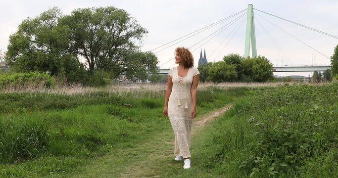Woman during stroll on 'Poller Wiesen'