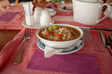 Borsch in a plate on a tablecloth