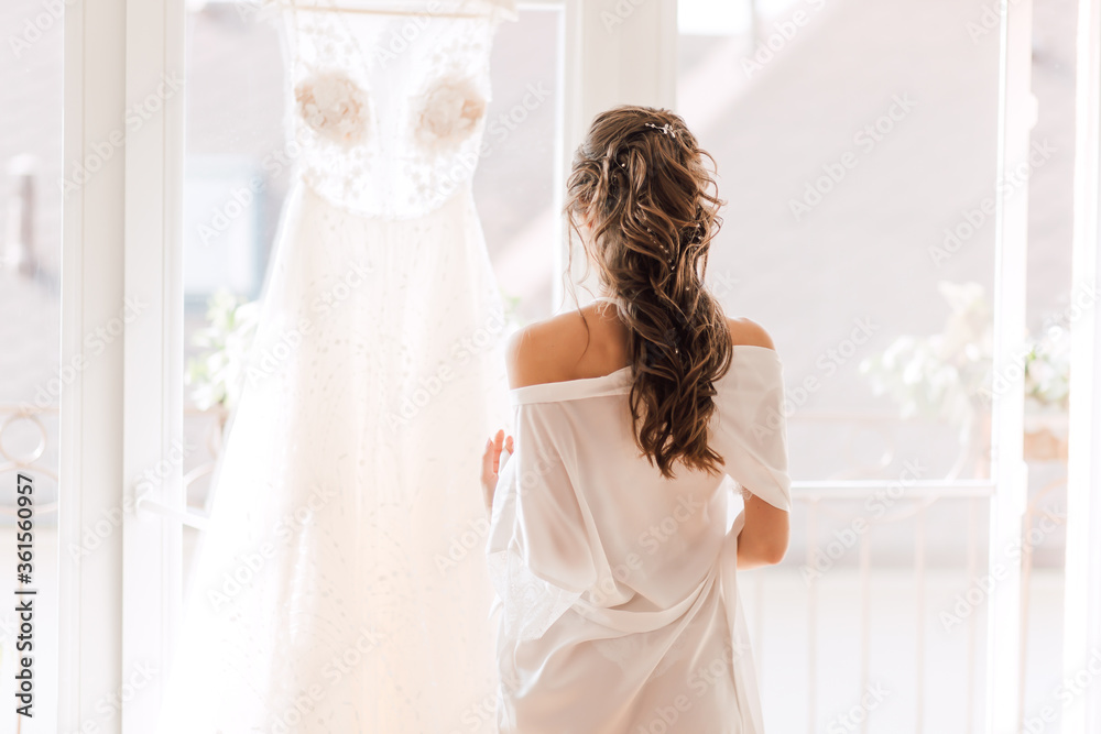 Wall mural a magnificent wedding dress for the bride before the ceremony - Wall murals