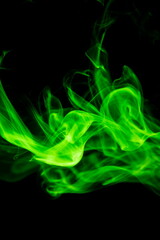 Green smoke on black background