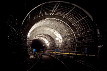 Brightly lit railway fork in the road ways in the subway  © Aleksandr