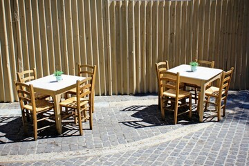 Greece, Athens, June 17 2020 - Empty chairs of a traditional bar-restaurant in the touristic district of Monastiraki.