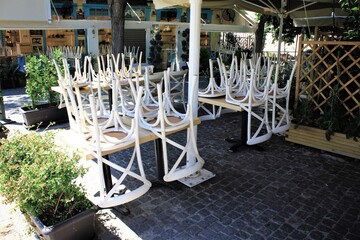 Greece, Athens, June 17 2020 - Chairs stacked outside of a traditional restaurant in the touristic district of Monastiraki.