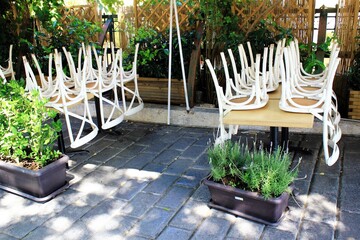 Greece, Athens, June 17 2020 - Chairs stacked outside of a traditional restaurant in the touristic district of Monastiraki.