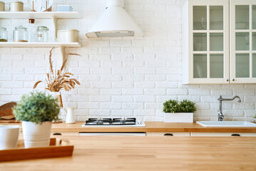 Kitchen wooden table top and kitchen blur background interior style scandinavian