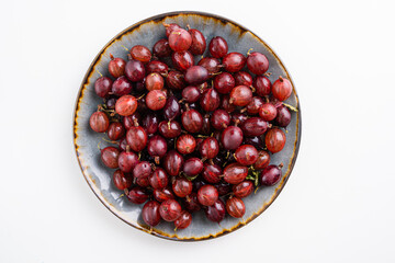 Close up shot of red gooseberry harvest. Healthy lifestyle and eating. Vegan food