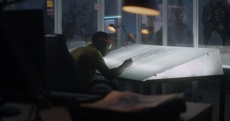 Young graphic designer drawing concept art