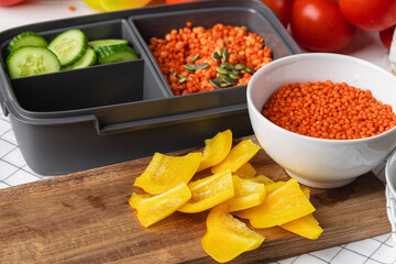 Close up photo of plastic lunch box with cooked food