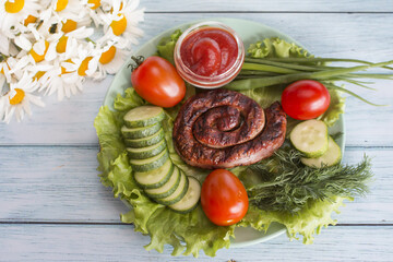 fried sausage with fresh vegetables and herbs.