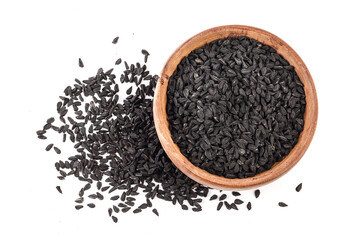Nigella sativa or Black cumin in wooden bowl isolated on white background. Top view. Flat lay.