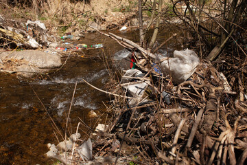 River after flooding, cluttered up with garbage
