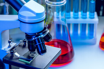 Microscope lenses on a laboratory desk close up