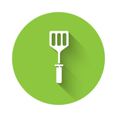 White Spatula icon isolated with long shadow. Kitchen spatula icon. BBQ spatula sign. Barbecue and grill tool. Green circle button. Vector Illustration.