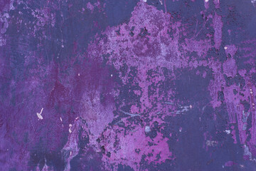 Bright purple, turquoise texture dirty dark wall with cracks. Colorful peeling old texture, texture with peeling paint. Colorful Wall Street Tint. Pattern, blank with free space