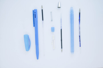 Blue ballpoint pen isolated on white background. Pivot of the ball pen. Ballpoint parts.