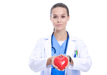 Positive female doctor standing with stethoscope and red heart symbol isolated. Woman doctor