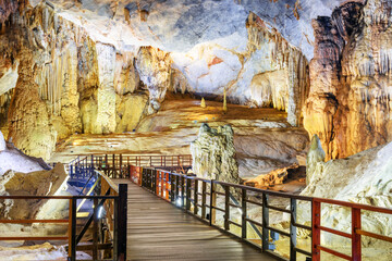 Walkway among stalactites and stalagmites. Paradise Cave