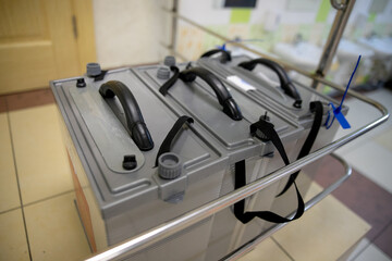 Ballot boxes for elections with the emblem of Russia at a polling station.