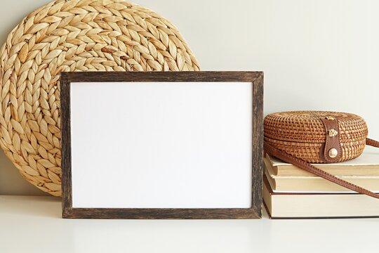 Dark wood frame mockup, boho style empty photo frame, horizontal wooden sign mock-up for artwork, bohemian interior.