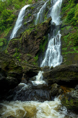 Fototapeta premium Beautiful waterfall in deep forest at National Park, Kamphaeng Phet province, Thailand.
