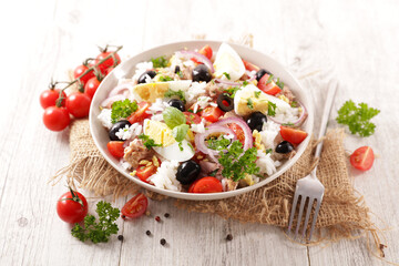 rice salad with olive, egg, tuna and tomato