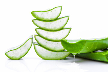 Green fresh aloe vera leaf with sliced isolated on white background.Natural herbal medical plant ,skincare ,health and beauty spa concept.  - obrazy, fototapety, plakaty