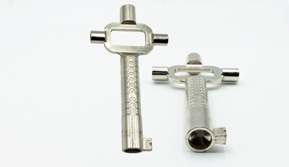 Several views of a universal cam key to open doors in locksmithing