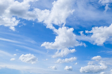 Obraz na płótnie Canvas Group of white fluffy clouds and bright blue sky.