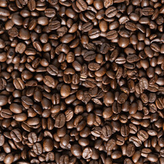 Roasted arabica coffee beans background on wooden table.Arabica coffee is the world's most popular type of coffee.