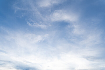 Naklejka na ściany i meble A group of clouds floating in the blue sky was blown to change shape in the summer