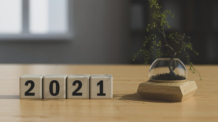 inscription 2021 made of wooden cubes on the table