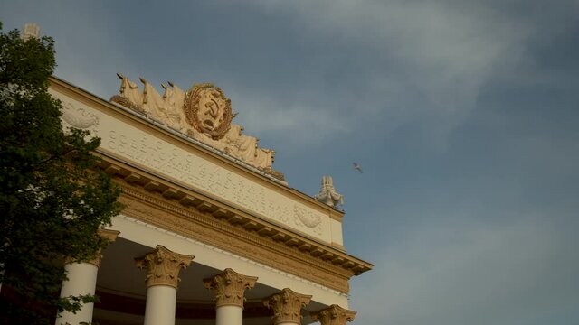 Soviet building with columns and stucco molding.Close-up view dolly camera shot