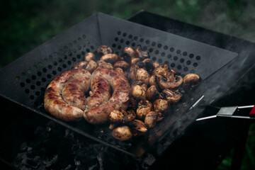 Grilled chicken sausage with mushrooms in a pan
