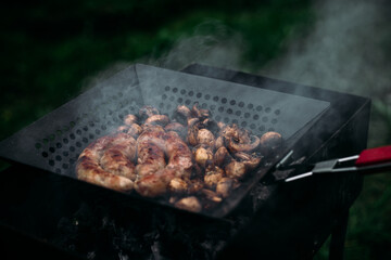 Grilled chicken sausage with mushrooms in a pan