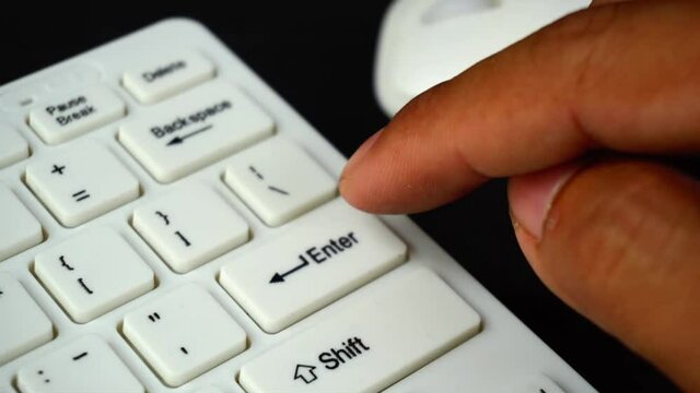 His hand working with computer and mouse keyboard
