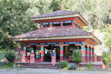 Fototapeta premium Land of Medicine Buddha Temple. Soquel, California. The meaning of the Lantsa/Ranjana scripts are not literal but more symbolic about the mantras that give blessings when one walks under them.