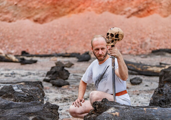 War a wanderer in the mountains resting after a battle with a dagger in his hand