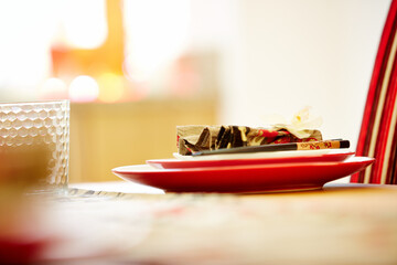 Plates with napkin and chopsticks on dining table