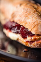 French baguette with hot Camembert cheese with jam