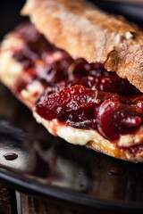 French baguette with hot Camembert cheese with jam