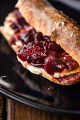 French baguette with hot Camembert cheese with jam
