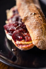 French baguette with hot Camembert cheese with jam