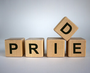 Wooden cubes with word 'pride'. Concept image.