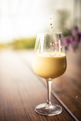 glass of ice turmeric latte