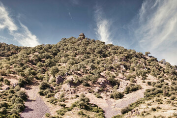 Rajasthan, India - October 06, 2012: A landscape of hilly mountains surrounding abandoned cursed...